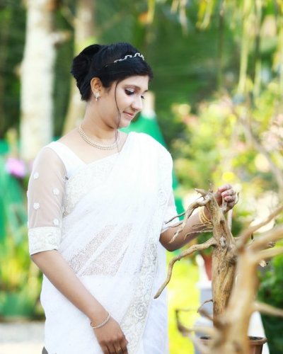 Adorable bride with in white saree - feathertouch beauty salon, pathanamthitta